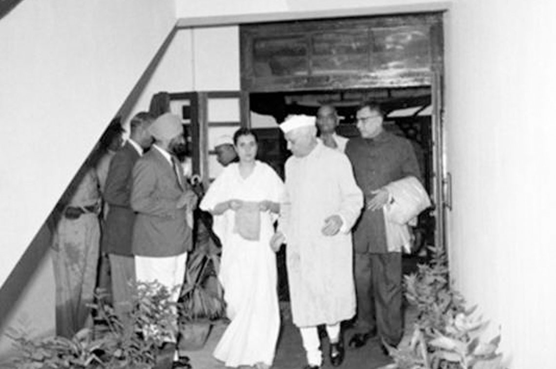The Prime Minister and his daughter, Mrs. Indira Ghandhi. after a conducted tour of the factory, arriving at the meeting hall to address the staff and invited guests. At right is Dr. Harekrushna Mahtab, Governor of Bombay State on 2nd August 1956 