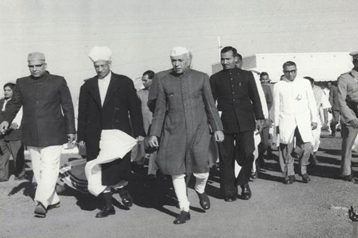 Jawaharlal Nehru with S. Radhakrishnan and Harekrushna Mahtab along with a group of people proceeding towards airport while coming back from their visit to Orissa 