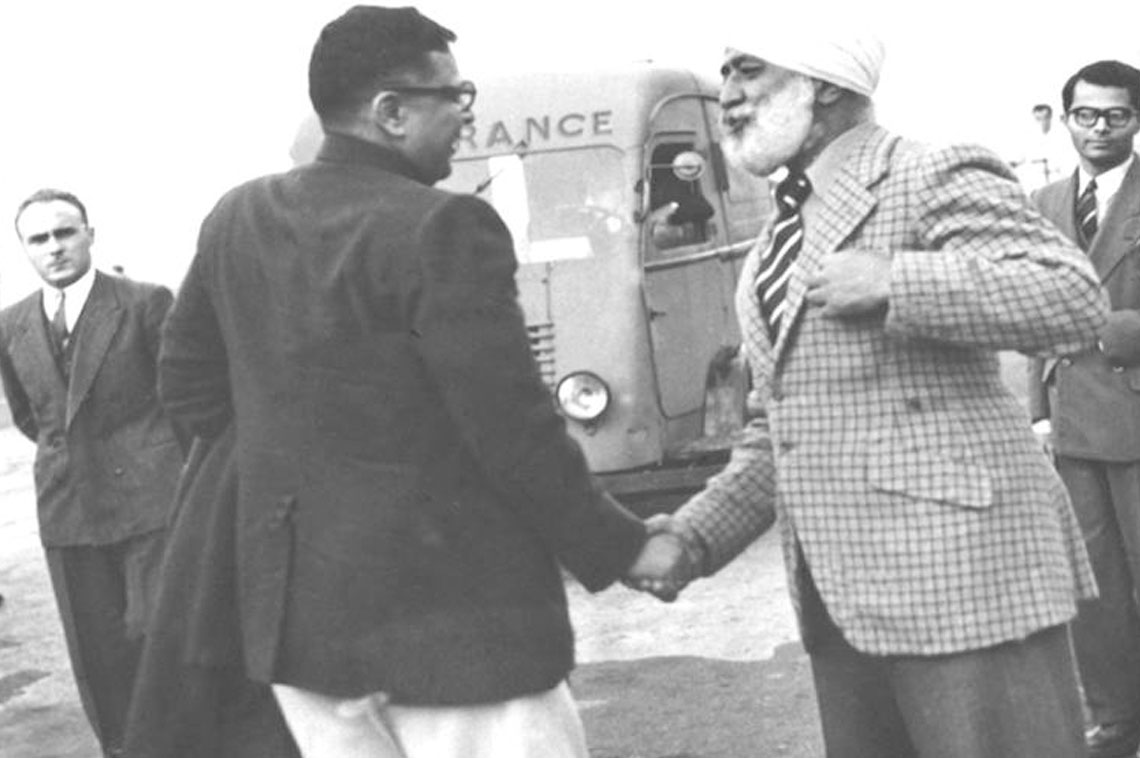 Dr Harekrushna Mahtab, India’s Minister for Industry & Commerce being greeted by the Indian Ambassador in Paris, Sardar H.S. Malik, when the former arrived in Paris Airport, en route to U.K. to attend the Commonwealth Supply Ministers’ Conference held in London, in the first week of October, 1951.  